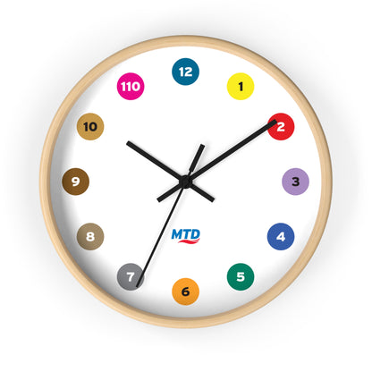 Primary Alt Text Round wall clock featuring colorful MTD route bubbles arranged as hour markers on a white clock face with the MTD logo in the center.
