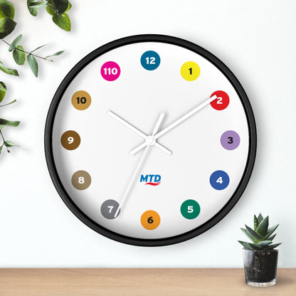 Primary Alt Text Round wall clock featuring colorful MTD route bubbles arranged as hour markers on a white clock face with the MTD logo in the center.