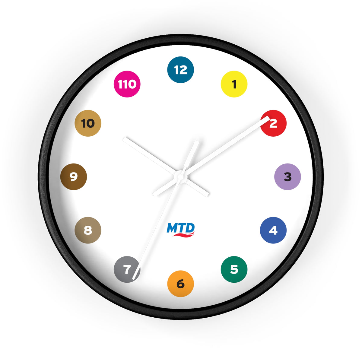 Primary Alt Text Round wall clock featuring colorful MTD route bubbles arranged as hour markers on a white clock face with the MTD logo in the center.