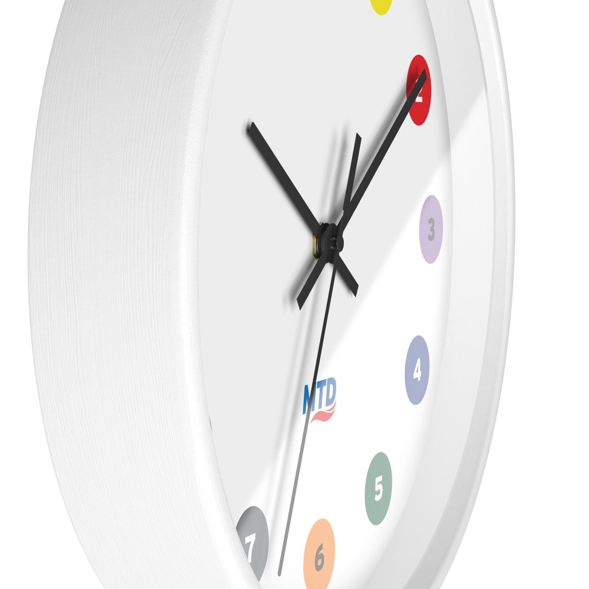 Primary Alt Text Round wall clock featuring colorful MTD route bubbles arranged as hour markers on a white clock face with the MTD logo in the center.