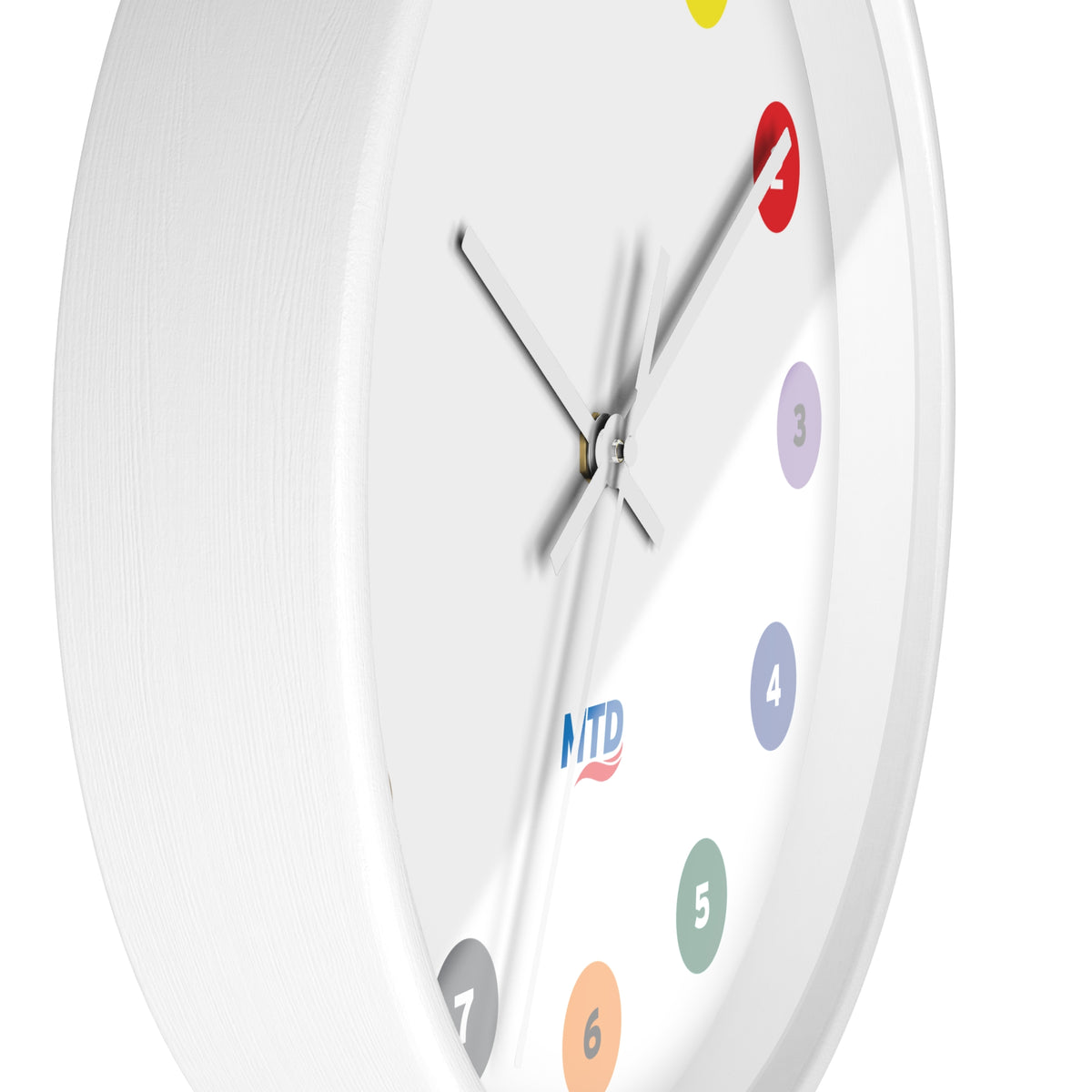 Primary Alt Text Round wall clock featuring colorful MTD route bubbles arranged as hour markers on a white clock face with the MTD logo in the center.