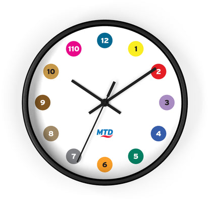 Primary Alt Text Round wall clock featuring colorful MTD route bubbles arranged as hour markers on a white clock face with the MTD logo in the center.