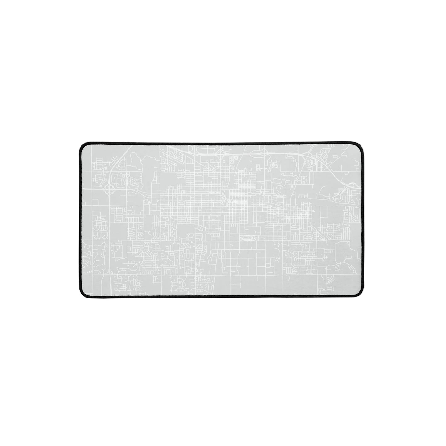Gray rectangular desk mat with white outline of streets in Champaign-Urbana, Illinois.