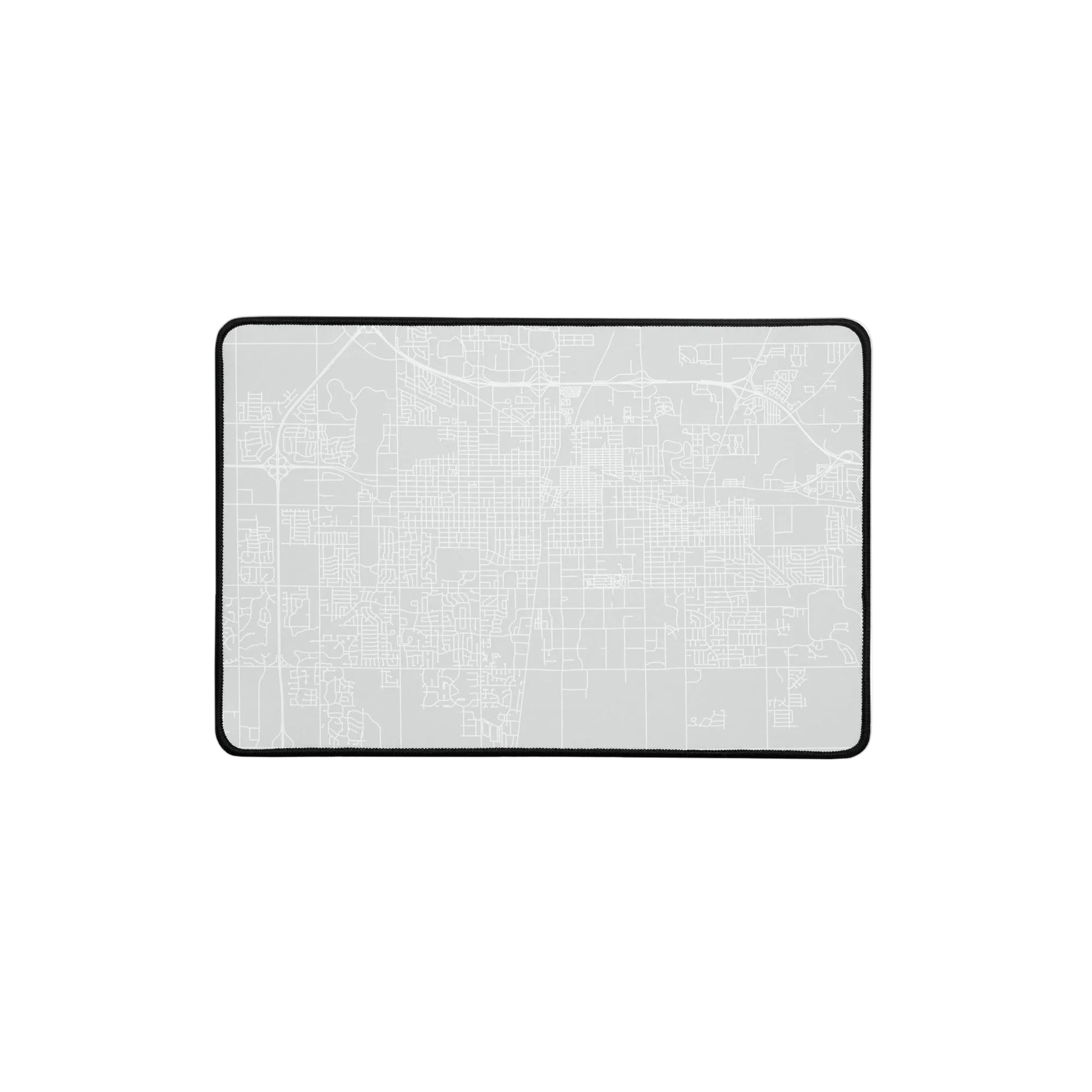Gray rectangular desk mat with white outline of streets in Champaign-Urbana, Illinois.