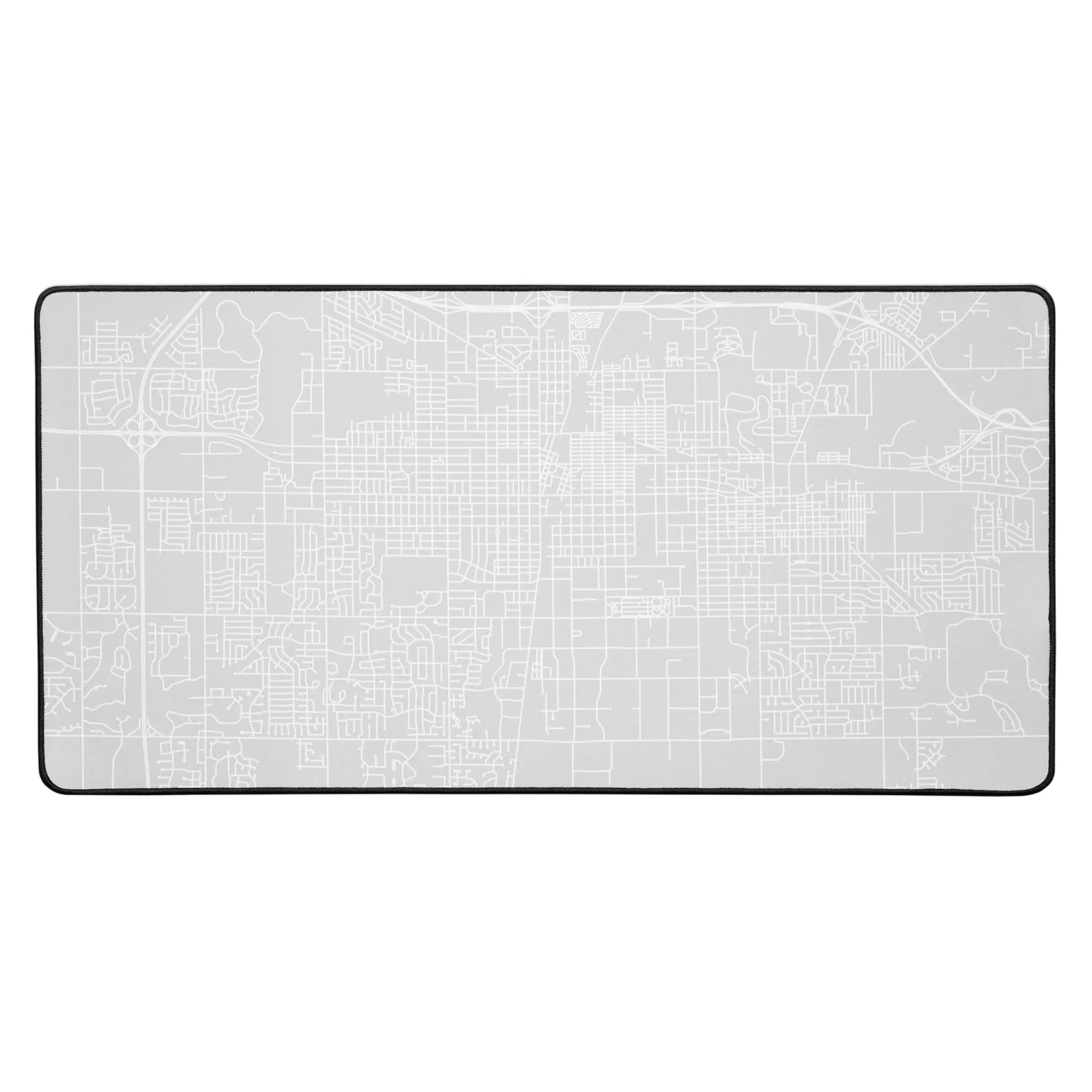 Gray rectangular desk mat with white outline of streets in Champaign-Urbana, Illinois.